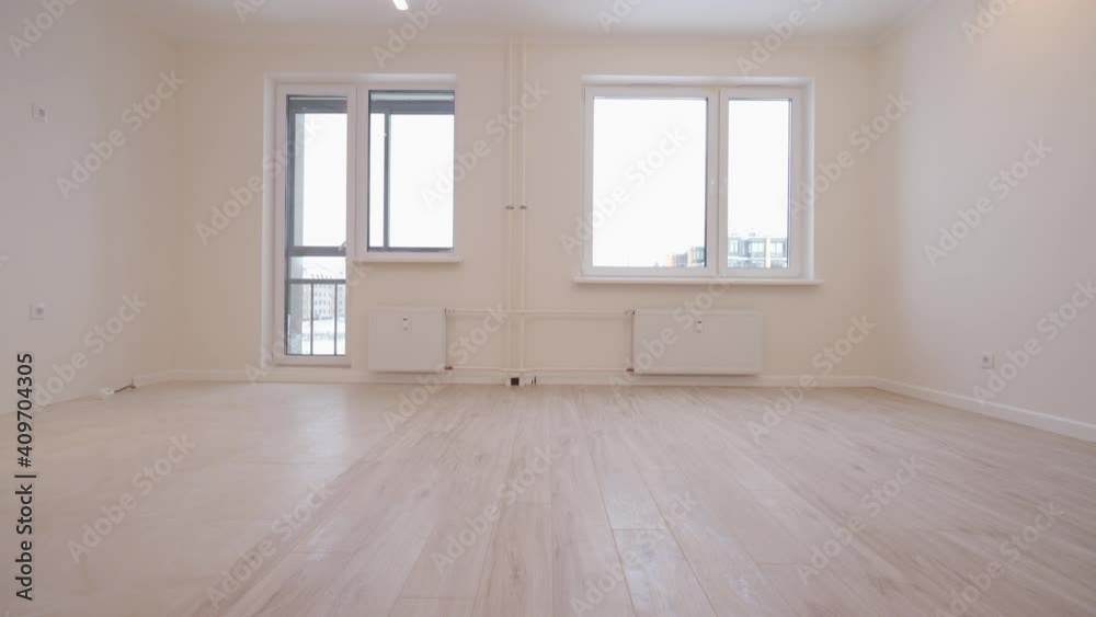 Moving in new apartment white flat interior, view of empty rooms new home construction.