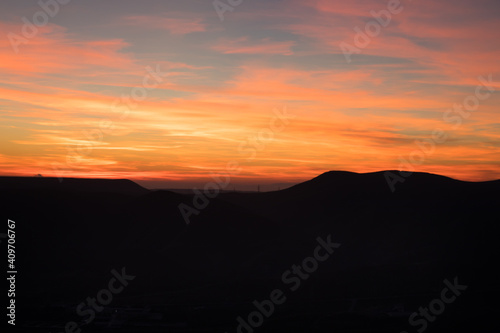 Colorful sunset over the mountain hills. Beautiful landscape in Azerbaijan nature.