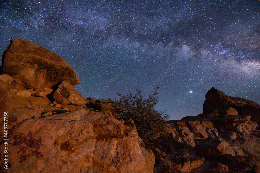 Milky way galaxy over rock formations in western Colorado