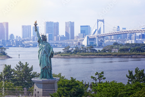 Statue of Liberty on Tokyo Bay in Japan with the Rainbow Bridge and skyscrapers in the background © J. Borruel