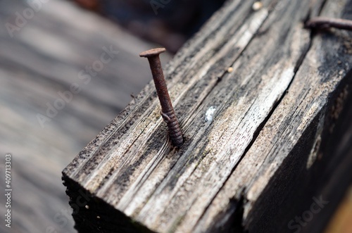 old wood texture with rusted nail