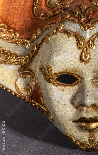 Traditional venetian carnival mask on grey background