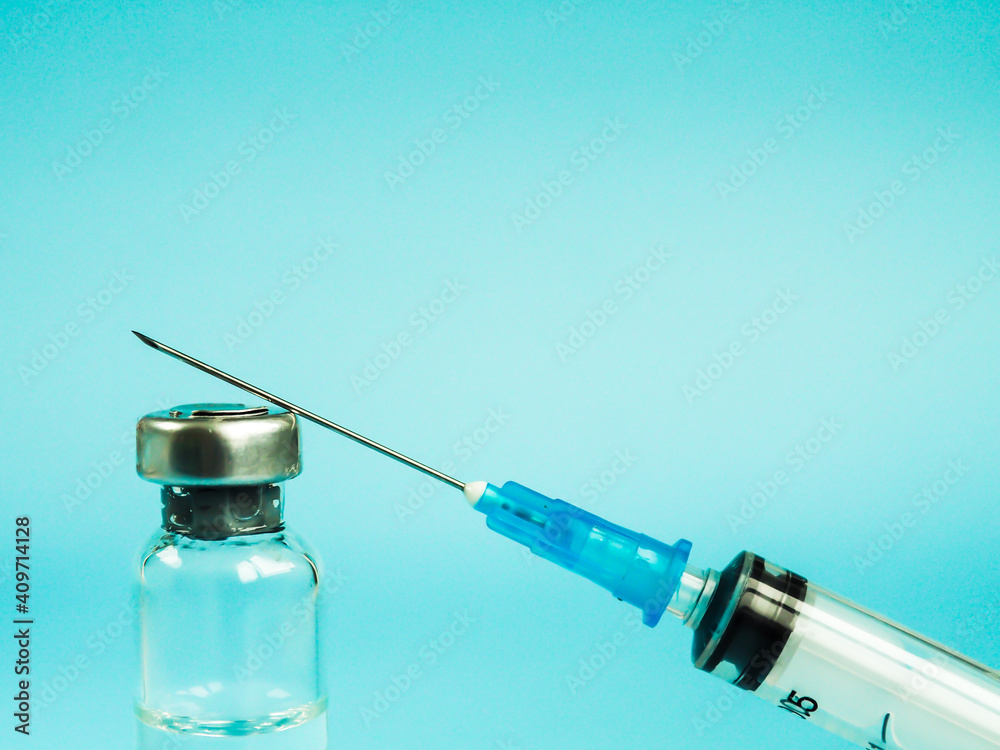 Vaccine and syringe injection. Vials medicine bottles. Laboratory. Prevention,immunization and treatment from corona virus infection COVID-19. Healthcare. Medical concept. Space for text Vaccine and syringe injection. Vials medicine bottles. Laboratory. Prevention,immunization and treatment from corona virus infection COVID-19. Healthcare. Medical concept. Space for text