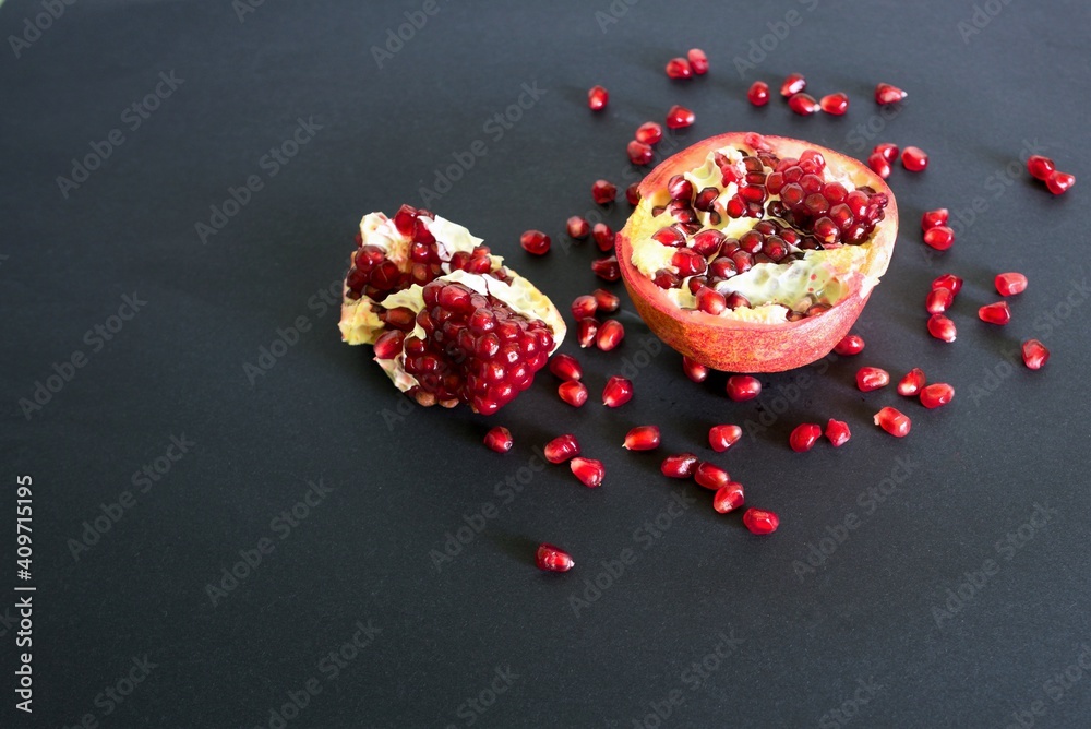 pomegranate seeds on a black background pomegranate seeds on a black background