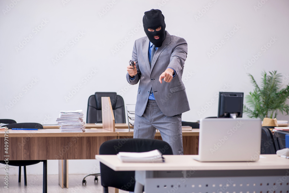 Young male employee in industrial espionage concept Young male employee in industrial espionage concept
