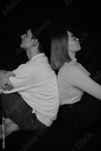 black and white portrait of a loving couple close-up on a black background. Couple in love. A family. Valentine's Day.