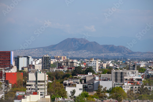 Tetlalmanche volcano aka Volcan Guadalupe with Modern city buildings aerial view in La Condesa district in downtown Mexico City CDMX, Mexico.