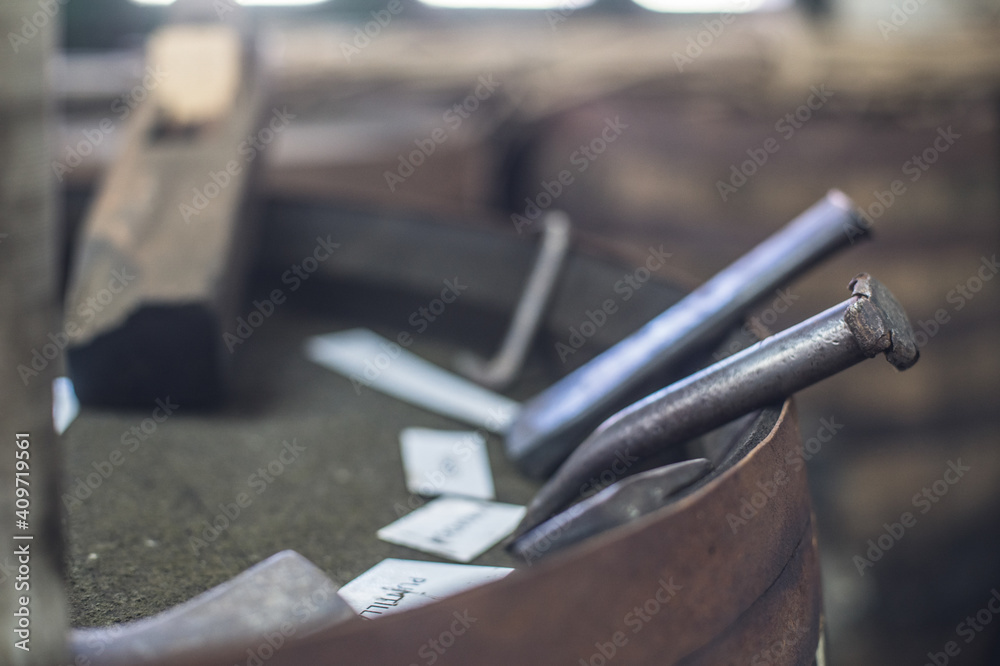 chisel in wooden barrel