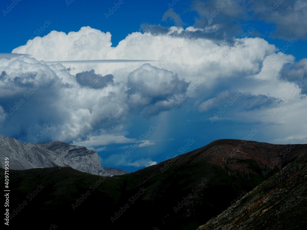 Thundercloud forming along the front range of the Canadian Rockies Alberta Caada   OLYMPUS DIGITAL CAMERA