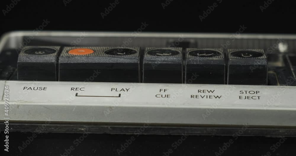 Panorama, control buttons of an old cassette recorder. Play, record, stop and rewind buttons. Panorama, control buttons of an old cassette recorder. Play, record, stop and rewind buttons.