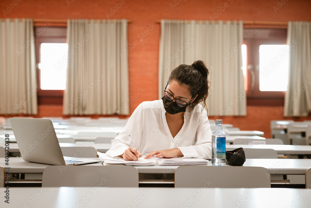 Latin Female Student wearing mask at university
