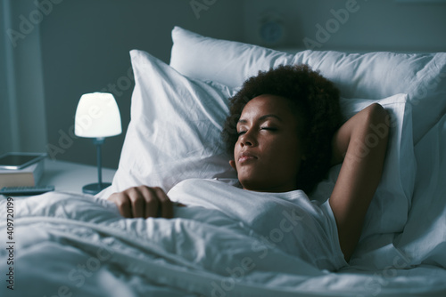 Woman sleeping in her bed