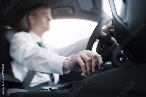 Businessman driving to work © StockPhotoPro