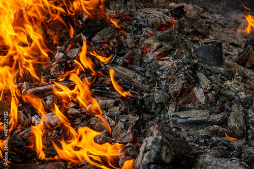 Burning coals at night, rotting coal, barbecue season. Close-up