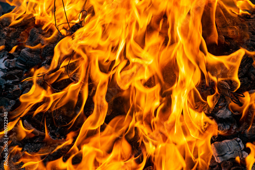 Fire creates infinity shapes when it burns. The orange from the flame and the black backgroud creates interesting textures. Flames from hell.