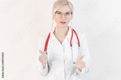 Head shot of woman wearing white coat stethoscope on shoulders looking at camera, doctor make video call interact through internet talk with patient provide help online counseling and therapy concept