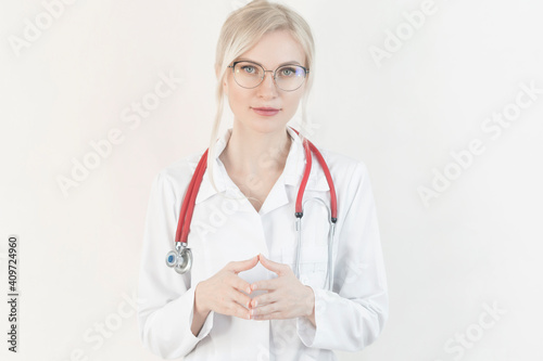 Head shot of woman wearing white coat stethoscope on shoulders looking at camera, doctor make video call interact through internet talk with patient provide help online counseling and therapy concept