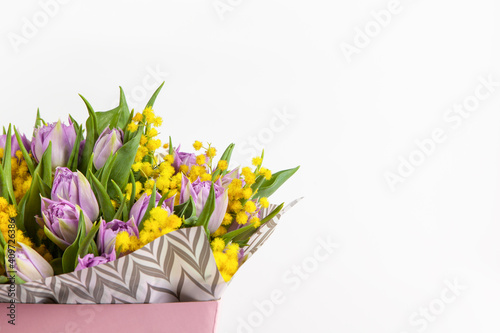 Wallpaper Mural Bouquet of lilac tulips and yellow mimosas in pink box on white background, copy space, side view. March 8, February 14, birthday, Valentine's, Mother's, Women's day celebration, spring concept Torontodigital.ca