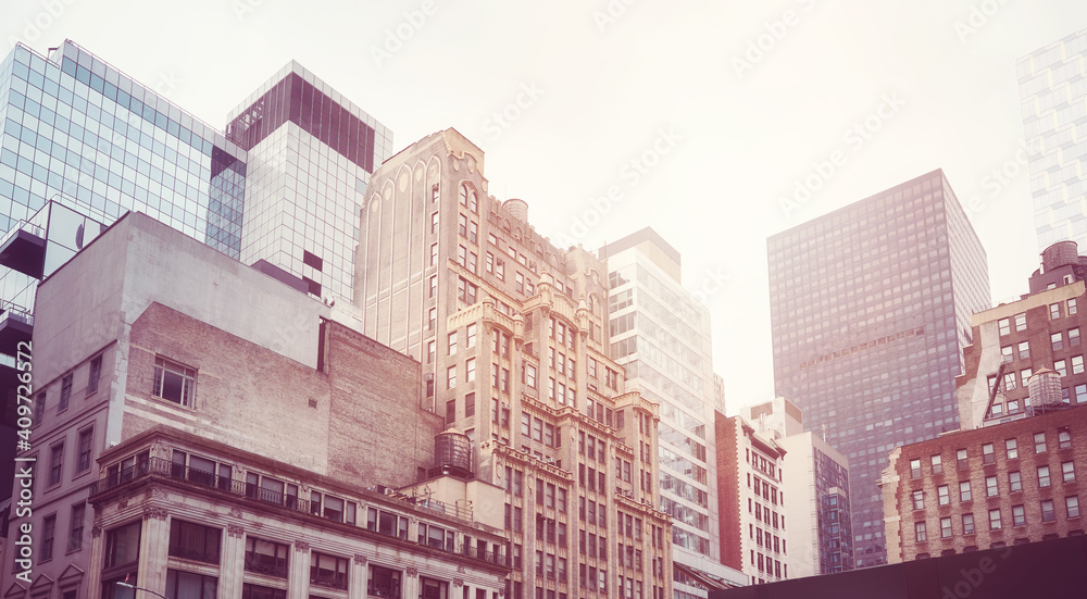 Old and modern buildings in New York City, color toning applied, USA.