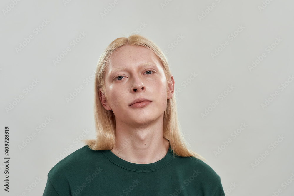 Portrait of young man posing on light background Portrait of young man posing on light background