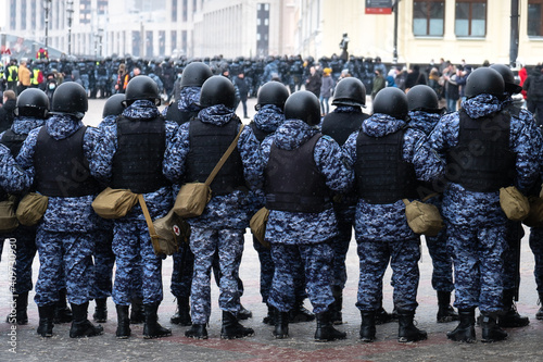 Police officers stand in a cordon on unauthorized political rally in support of the arrested opposition leader Alexei Navalny on january 31, 2021 on Komsomolskaya Square in Moscow . Rear view. photo