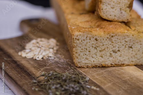 Rustic homemade bread made from rosemary and oats. Healthy homemade bread recipe. 