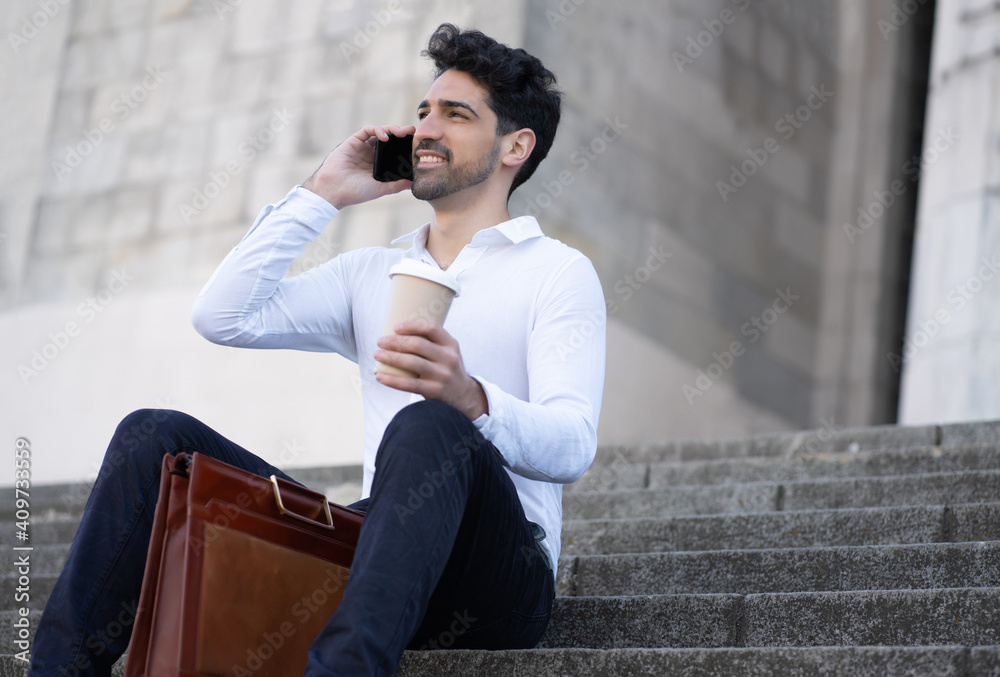 Business man talking on the phone outdoors. Business man talking on the phone outdoors.