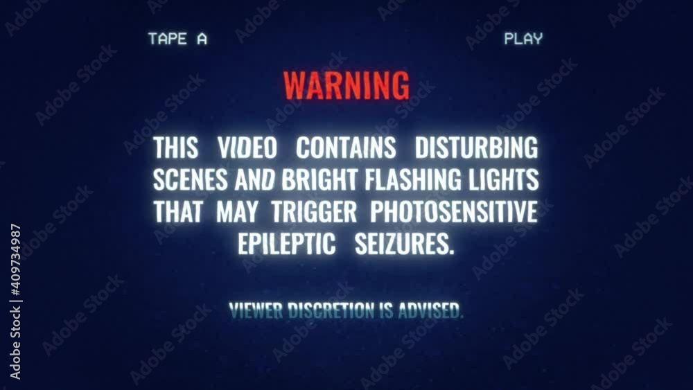 An old VHS tape (recreated with noise and distortion) with a warning message about disturbing scenes and bright flashing light (triggers for epileptic seizures).
