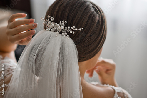 Wedding decoration for the brides hairstyle similar to branches with pear