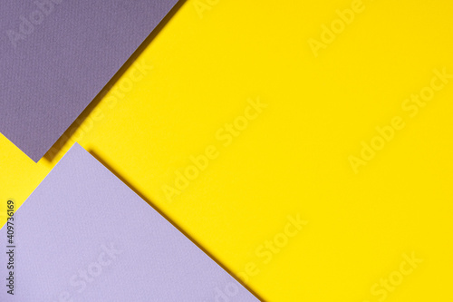 Abstract geometric paper background in yellow, light and dark gray colors