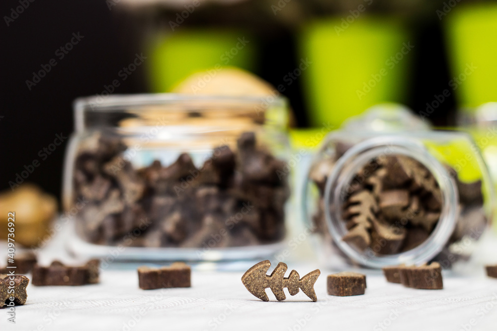 Dog treats spilling out of bowl. Dog treats and biscuits Dog treats spilling out of bowl. Dog treats and biscuits