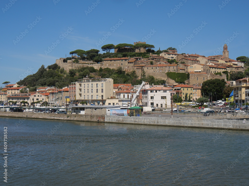 Panorama of Castiglione della Pescaia from the mouth of the Bruna river. In the background the upper part of the village with the walls and the castle.