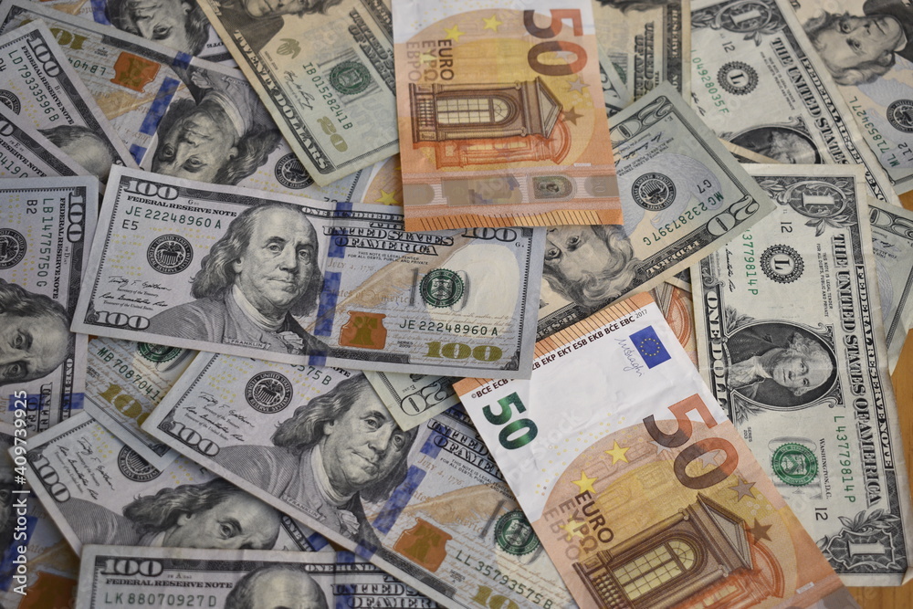 dollar and euro bills in disarray
