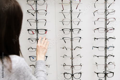 Row of glasses at an opticians. Eyeglasses shop. Stand with glasses in the store of optics. © lisovoy