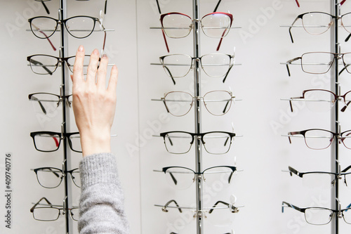 Row of glasses at an opticians. Eyeglasses shop. Stand with glasses in the store of optics. © lisovoy
