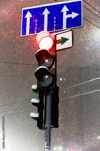 Red traffic light on the road