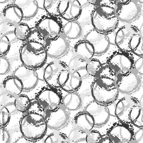Monochrome abstract grunge hand drawn circle stamps textile print on white background. Circular splotch overlapping elements seamless pattern. Grunge texture circle stamps textile print. Vector