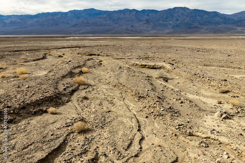 The rocky valley floor shows signs of flash floods in this wash in Death Valley National Park, California