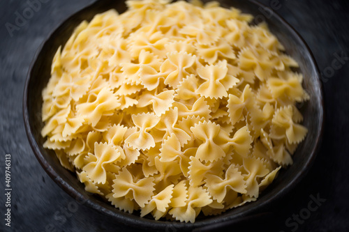 italian farfalle pasta raw uncooked blur defocused photo