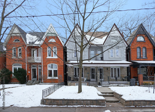 Residential street with older semidetached houses with gables photo