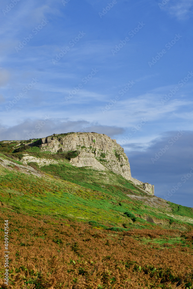 Cliffs along the Gower Peninsula, Wales. Beach cliffs and sea. 