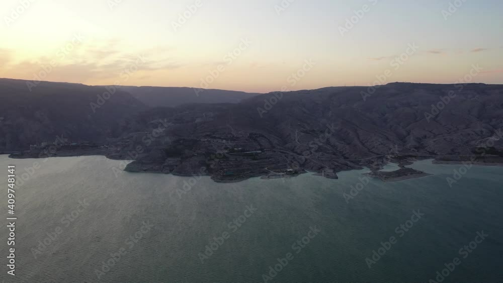 Drone shooting morning time in tranquil nature environment with beautiful reservoir lake for fishing during season time, aerial bird's eye view of vista landscape in wild National Park
