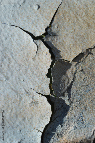 cracks, graffiti, peeling photo