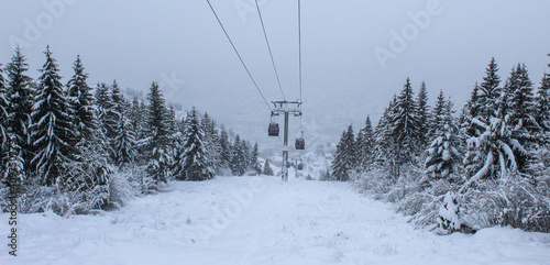 Banner. Cable car photographed from Trebevic in winter while it is snowing. Snow in winter on the mountain Trebevic. Sarajevo cable car in nature. Winter and snow.