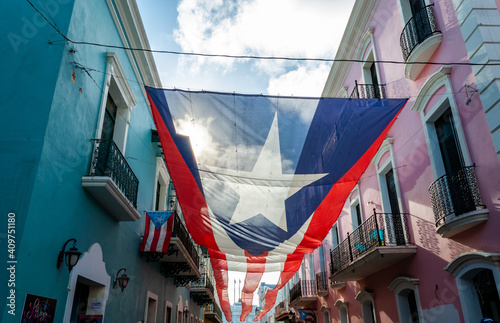 Large Puerto Rican Flag Hanging in the Streets of Old San Juan, Puerto Rico photo