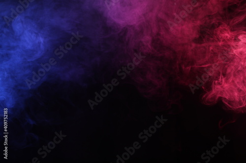 Smoke in red-blue light on black background