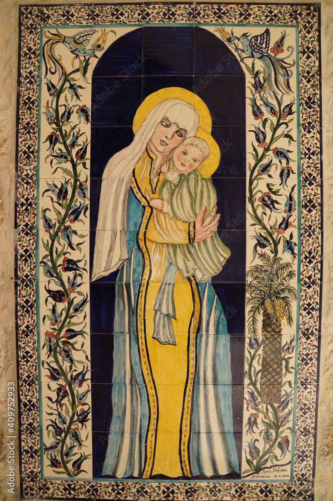 stained glass window in the church with the image of the Most Holy Theotokos