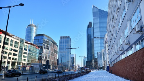 View of skyscrapers during snowfall.Urban cityscape and modern architecture background. 