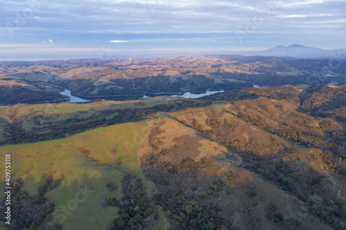 The last light of day illuminates the green, rolling hills just east of San Francisco Bay. This entire region turns green after winter storms bring rain.