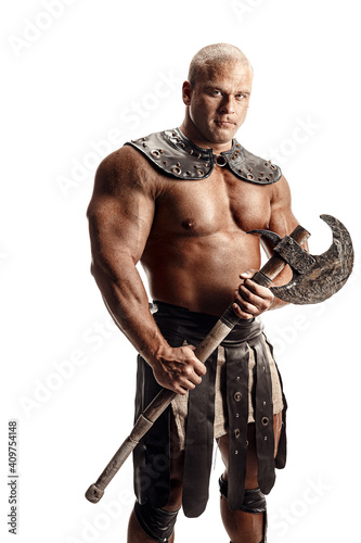 Studio shot of muscular ancient warrior man posing with axe. Isolated on white. Copy space